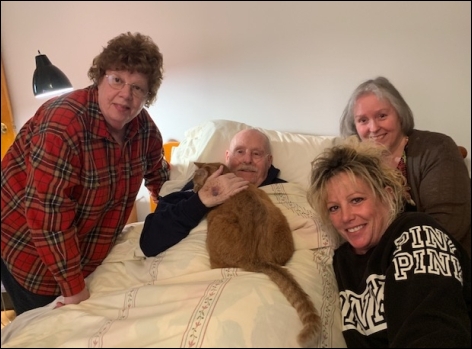 Joe surrounded by helpers